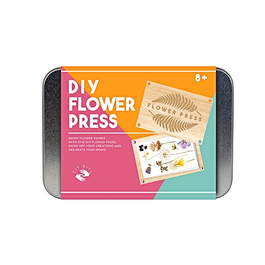 Metal tin with colorful label reading "DIY flower press."