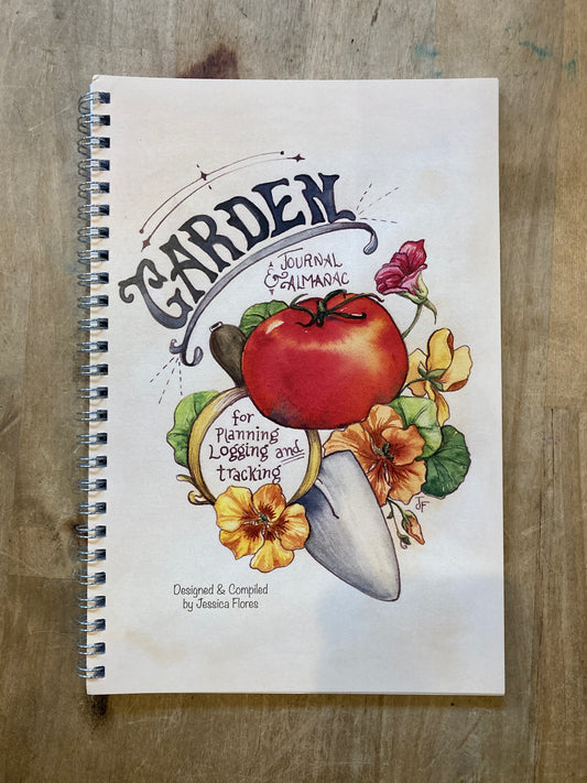 White  wire-bound notebook. Cover illustration of a tomato, flowers, and trowel. Text reads "Garden journal & almanac for planning, logging, and tracking."