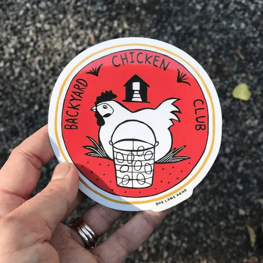 Round sticker with the text "Backyard Chicken Club" and an illustration of a hen next to a basket of eggs with a coop in the background.